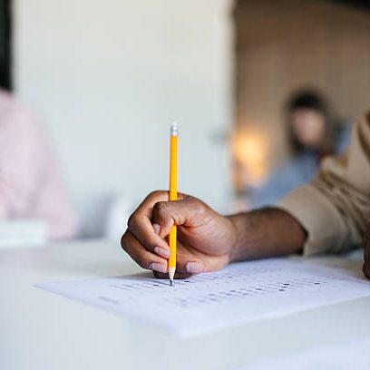 Focused students completing an academic test, fostering education, concentration, and mutual learning in a professional environment.
